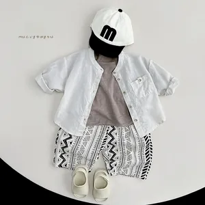 Kids ramie cotton summer clothing set with white shirt, patterned shorts and cap