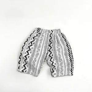 Detail of children's summer shorts with black and white geometric tribal pattern texture