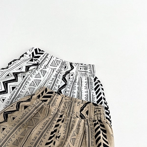 Detail of kids geometric print cotton shorts with comfortable elastic waistband