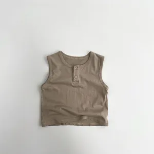 Detail of coffee brown baby vest featuring a ribbed henley neck and soft cotton texture