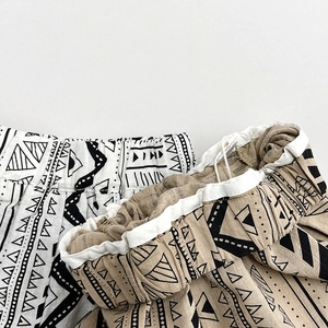 Kids geometric printed cotton linen wide-leg pants in black and khaki ethnic patterns
