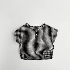 Detailed macro view of black and white gingham cotton fabric texture and white buttons