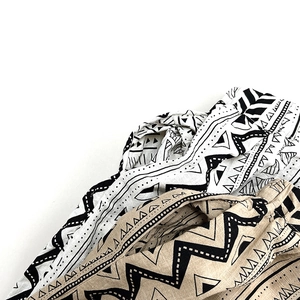 Close-up detail of geometric wave and triangle patterns on cotton casual pants