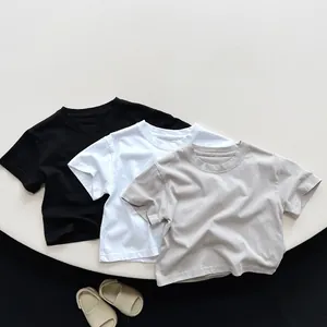 Flat lay of minimalist cotton kids' short sleeve T-shirts in black white and grey colors