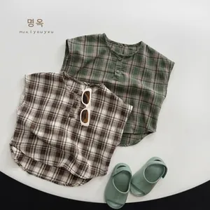 Close-up of kids breathable cotton plaid sleeveless shirts with decorative buttons
