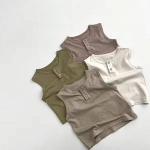 Detail of baby cotton sleeveless Henley vests with two buttons in four earth-tone colors