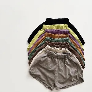 Detail view of 8 colors of bamboo cotton shorts for kids showing elastic waistband and hem