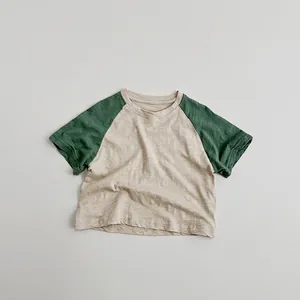 Close-up of kids raglan t-shirt showing breathable cotton slub fabric texture