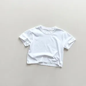 Flat lay close-up of a white cotton kid's T-shirt with a ribbed crew neck and clean seams