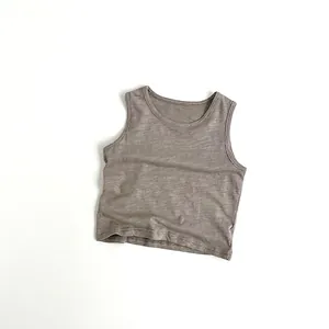 Detail shot of a brown slub cotton tank top showing the breathable fabric texture