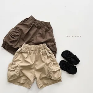 Detailed flat lay of kids cotton cargo shorts with elastic waist and side pockets