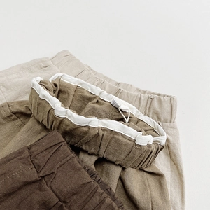 Detail of soft cotton linen kids cargo pants with comfortable elastic waistbands