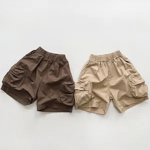 Kids cotton cargo shorts in brown and khaki colors with elastic waist and side pockets