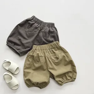 Detail view of cotton summer bloomers for kids with elastic waist and back pockets