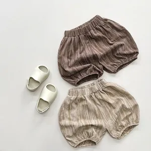 Kids tie-dye bloomers in brown and beige with organic wave print for summer