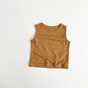 Detail view of mustard yellow bamboo cotton tank top showing neck trim and fabric texture