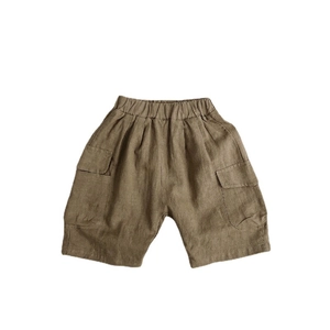 Kids linen cotton cargo shorts in brown featuring elastic waist and large side pockets