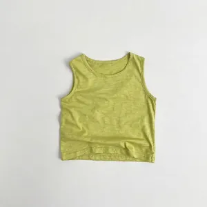 Detail of green bamboo cotton kids tank top showing ribbed texture and reinforced neckline