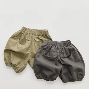 Detailed view of kids cotton linen bloomers in khaki green and charcoal grey colors