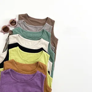 Close-up of stacked summer kids' tank tops showing 8 colors and slub cotton texture