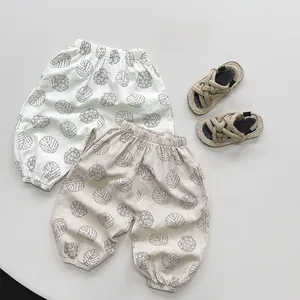 Detail view of summer cotton mosquito pants with leaf patterns and elastic cuffs