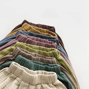 Detail showing elastic waistband and multi-color cotton gauze bloomers for toddlers
