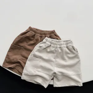 Detail of comfortable drawstring waist and soft knitted cotton fabric on kids casual shorts