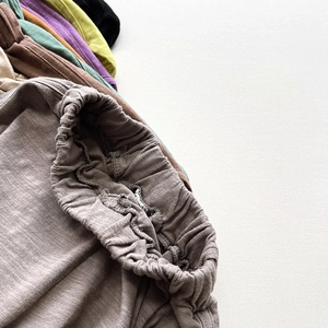 Detail of multi-color bamboo cotton shorts showing elastic waist and soft texture