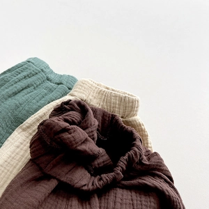 Close-up of elastic waistband on breathable cotton gauze shorts for toddlers and kids