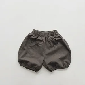 Detailed view of kids cotton bloomers featuring elastic waistband and charcoal texture