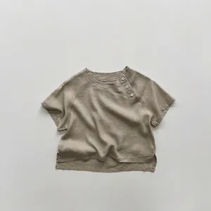 Detail of linen cotton kids shirt with three side buttons and minimalist split hem