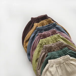 Close-up of lightweight cotton gauze kids bloomers in various Morandi colors with elastic waist