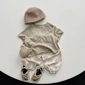Korean style toddler linen outfit with brown top, leaf print pants and bear bag