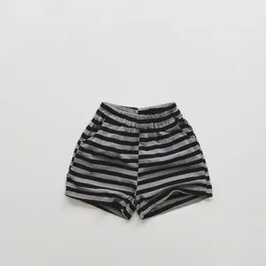 Detail view of cotton knit striped shorts for children with elastic waist and side pockets
