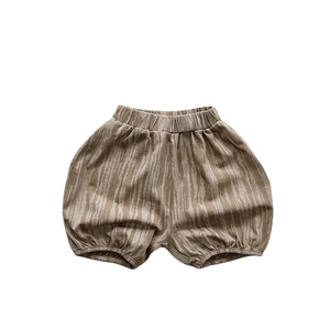 Kids tie-dye style bloomers in earthy brown with natural wood-grain texture pattern