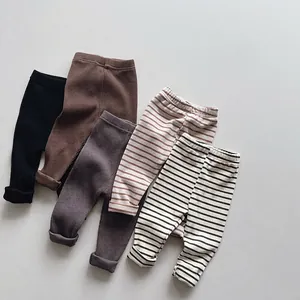 Five pack of minimalist cotton knit leggings for toddlers in solid colors and stripes