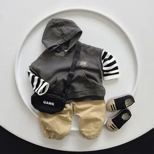 Kids grey hooded vest and striped shirt outfit set with khaki pants and crossbody bag