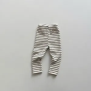 Detailed view of striped cotton baby leggings with comfortable elastic waistband