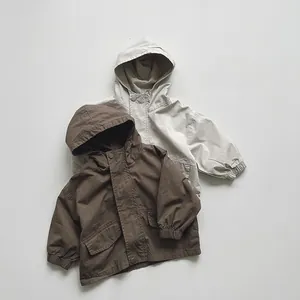 Close-up of windproof hooded jackets featuring large flap pockets and elastic cuffs