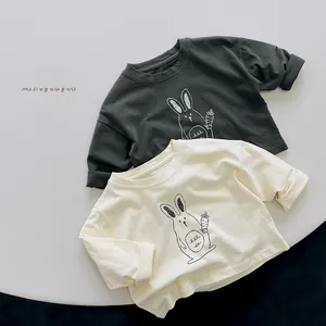 Detail of soft cotton kids long sleeve t-shirts with cute bunny and carrot prints