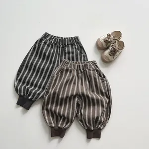 Detail of boys striped cotton joggers with elastic waist and ribbed ankle cuffs