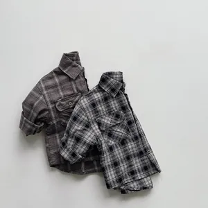 Close-up of children's long-sleeve plaid shirts with double chest pockets and soft fabric