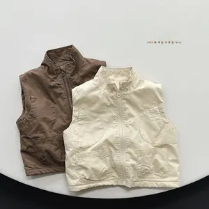 Flat lay of brown and off-white kid's fleece-lined cargo vests with large front pockets