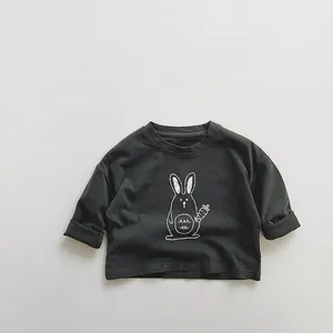 Detail of dark grey kids cotton t-shirt with a hand-drawn white rabbit print