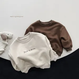 Detail showing ribbed cuffs and necklines on printed fleece sweatshirts for children