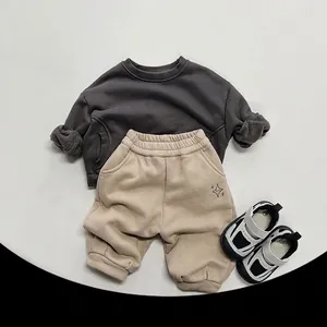 Winter casual fleece tracksuit for kids featuring a dark grey sweatshirt and khaki pants