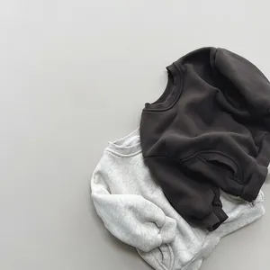 Detail of grey and black fleece sweatshirts featuring ribbed cuffs and crew neck collars