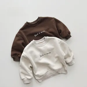 Detailed view of ribbed cuffs and high-quality heavy cotton fabric on kids sweatshirts
