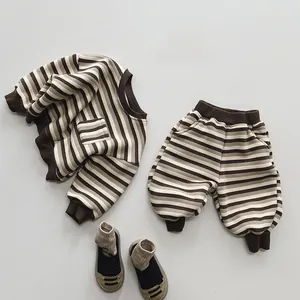 Close-up of kids retro brown striped knit set with warm fleece lining and chest pocket