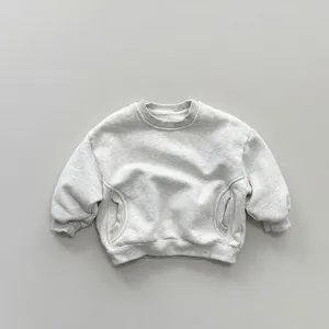 Detail view of children's grey marl fleece sweatshirt with ribbed cuffs and side pockets